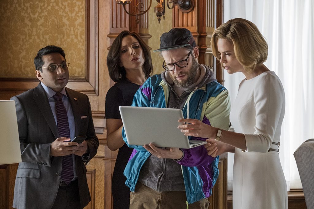 Tom (RAVI PATEL), Maggie (JUNE DIANE RAPHAEL), Fred Flarsky (SETH ROGEN), and Charlotte Fields (CHARLIZE THERON) in LONG SHOT. Photo Credit: Philippe Bossé.